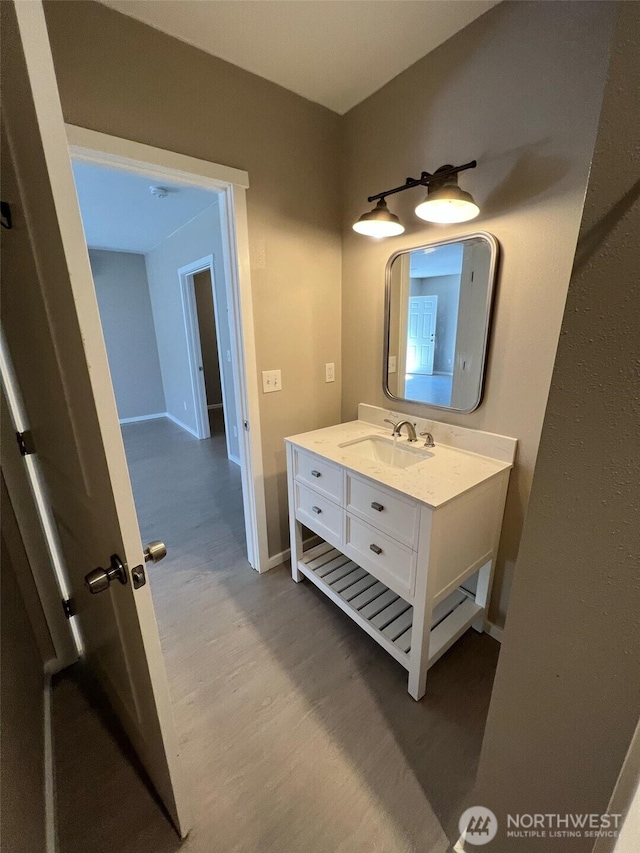 bathroom with wood-type flooring and vanity