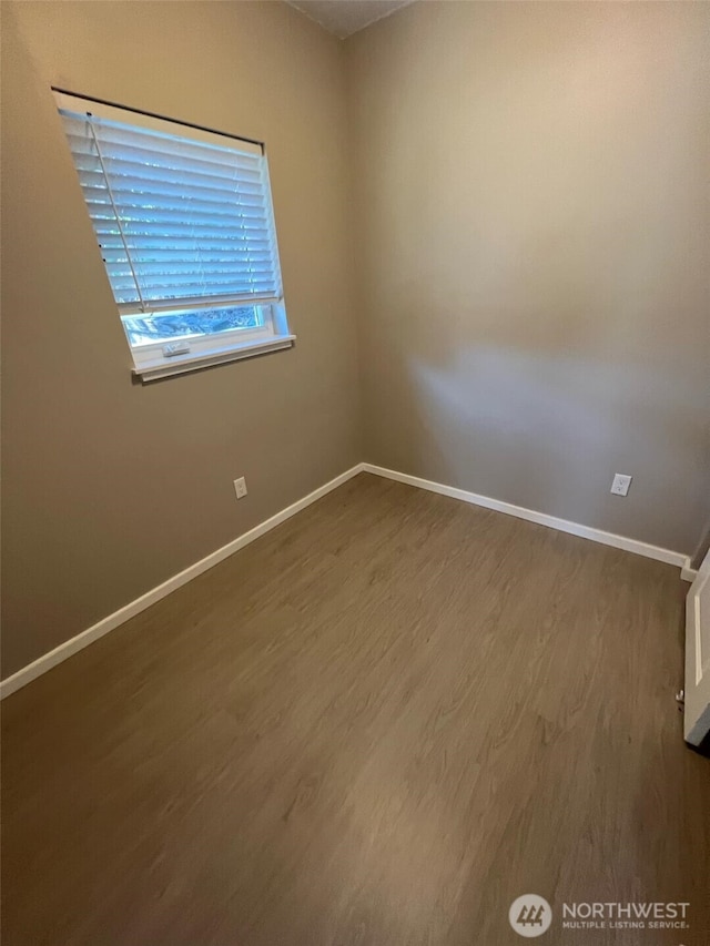 spare room featuring hardwood / wood-style floors