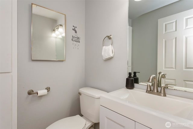 bathroom with vanity and toilet