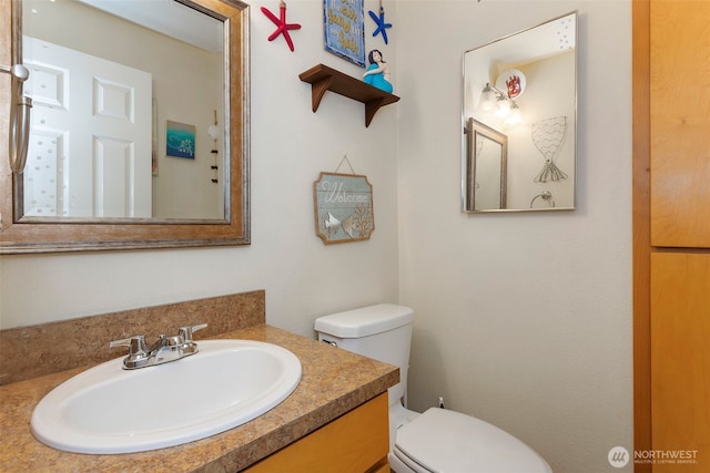 bathroom with vanity and toilet