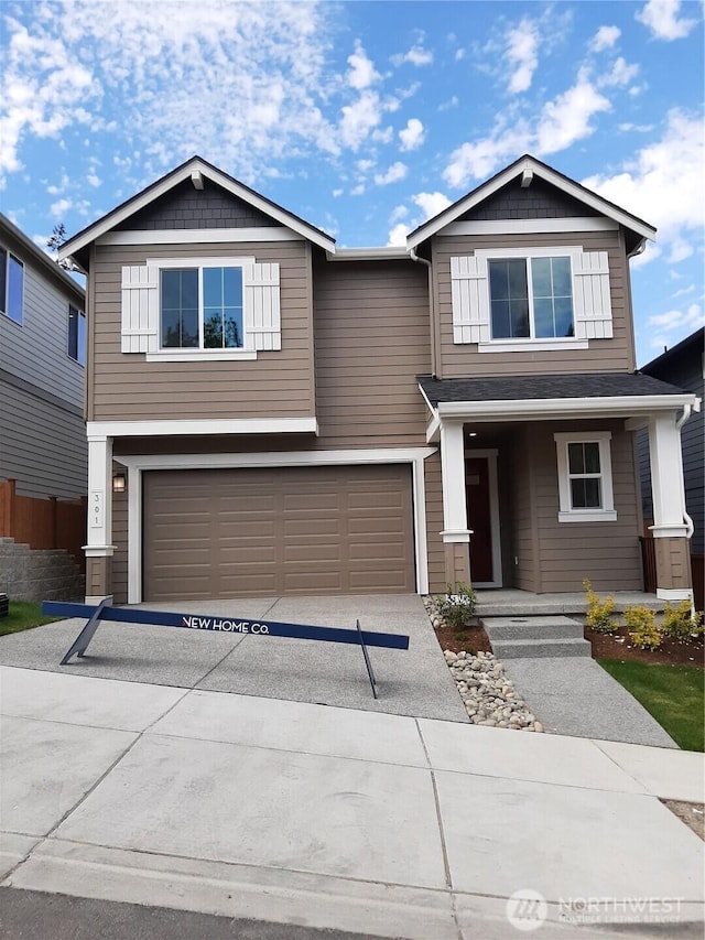 301 182nd Pl SE, Bothell, WA 98012 - view of front facade with concrete driveway and a garage