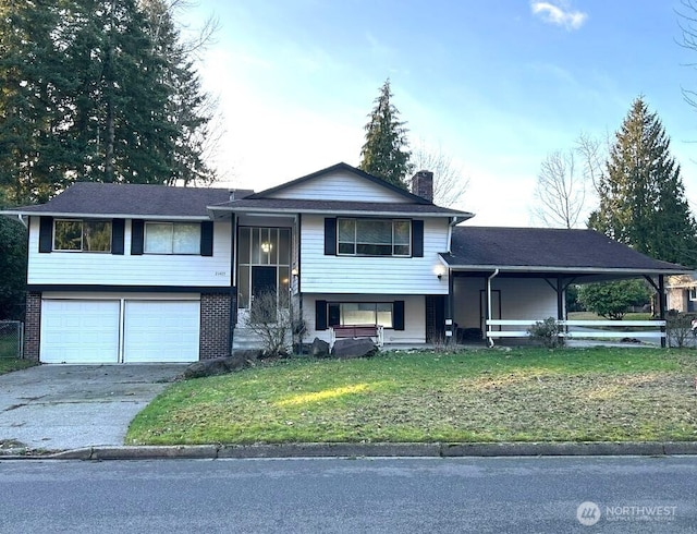 21405 124th Ave SE, Kent, WA 98031 - split foyer home with concrete driveway, a garage, a front lawn, and a chimney