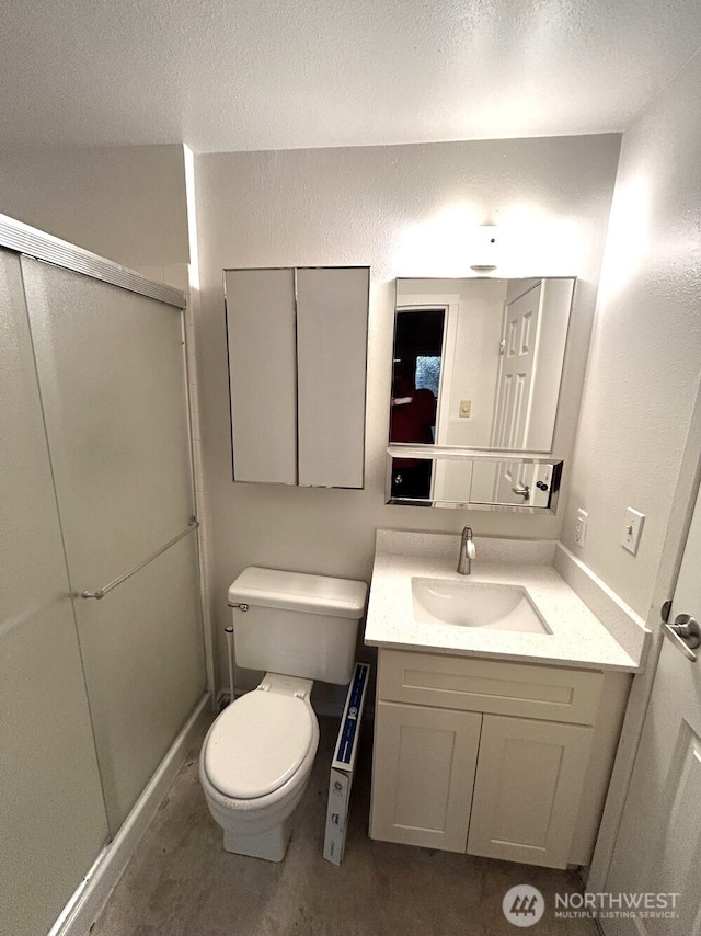 21405 124th Ave SE, Kent, WA 98031 - full bath featuring vanity, a shower stall, toilet, and a textured wall