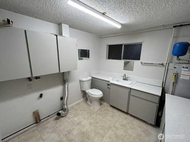 21405 124th Ave SE, Kent, WA 98031 - bathroom featuring vanity, toilet, water heater, and a textured ceiling