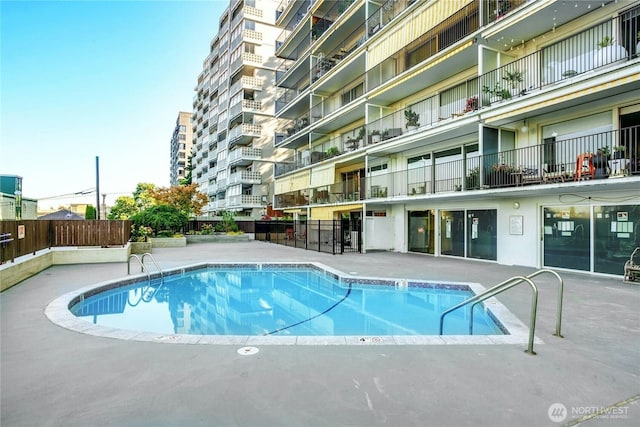 view of swimming pool with a patio