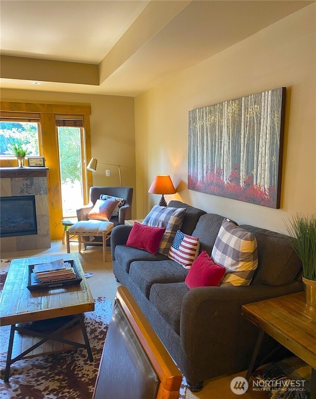 living room with a tiled fireplace