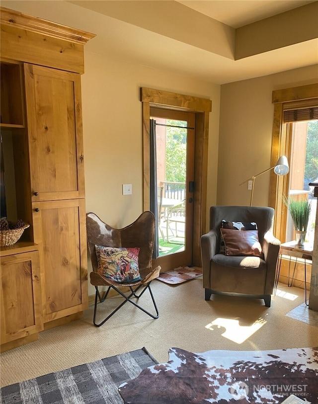 sitting room with light colored carpet