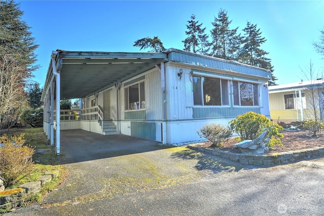 view of side of property with a carport