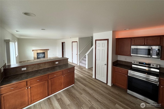 kitchen featuring wood-type flooring and appliances with stainless steel finishes