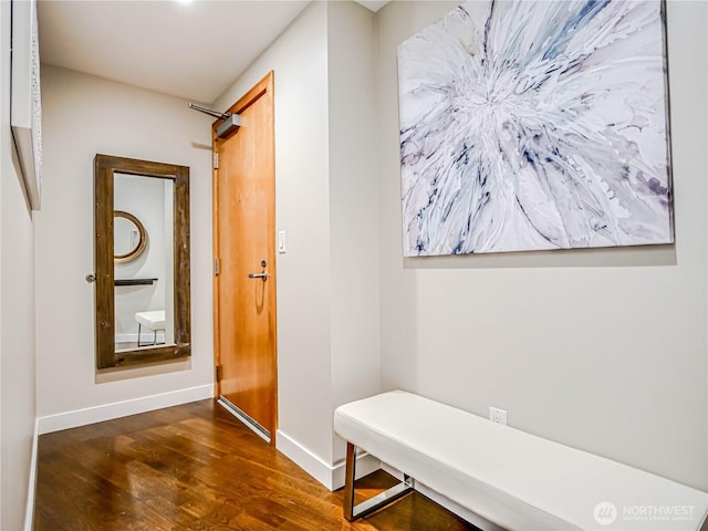 mudroom with wood finished floors and baseboards