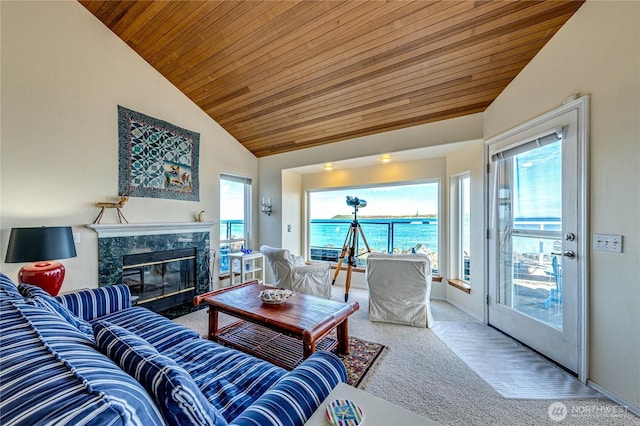 carpeted living area with high vaulted ceiling, a premium fireplace, wood ceiling, and baseboards