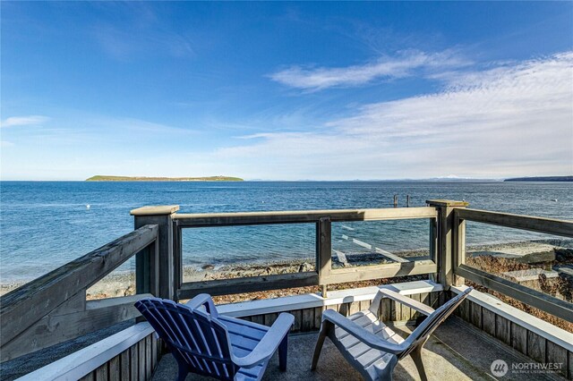 balcony featuring a water view