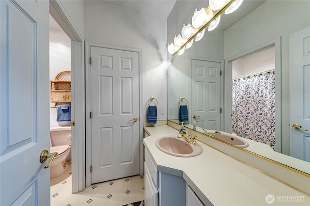 full bathroom with vanity and toilet