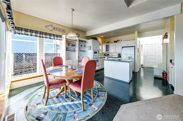 dining room featuring visible vents