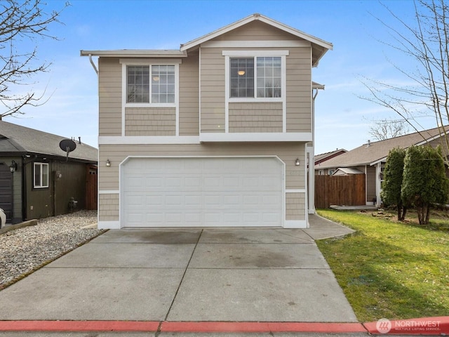 view of front of home with a front lawn, an attached garage, driveway, and fence