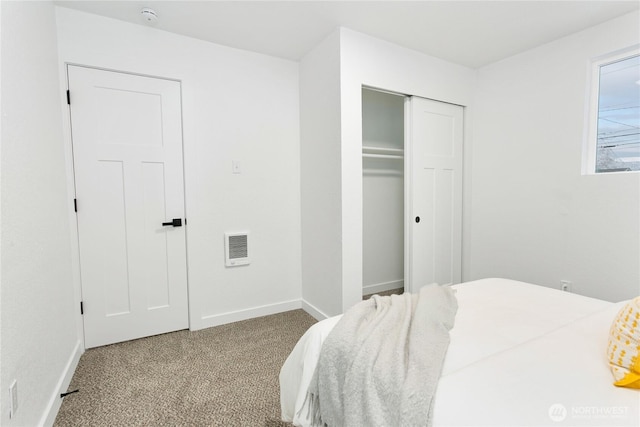 bedroom featuring light carpet, a closet, visible vents, and baseboards