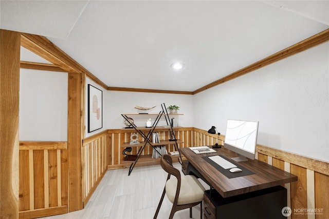 home office featuring crown molding and wooden walls