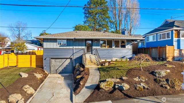 view of front of property with a garage