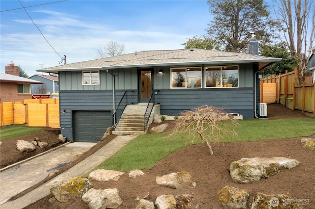 view of front facade featuring an attached garage, fence, driveway, board and batten siding, and a chimney