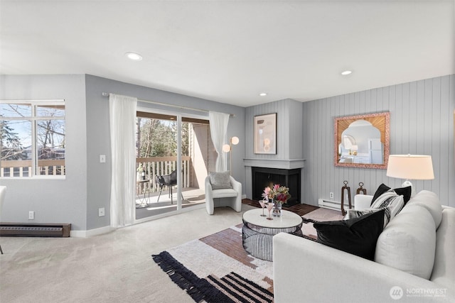 living room with carpet floors and baseboard heating