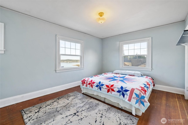 4412 Dyes Inlet Rd NW, Bremerton, WA 98312 - bedroom with multiple windows and dark hardwood / wood-style flooring