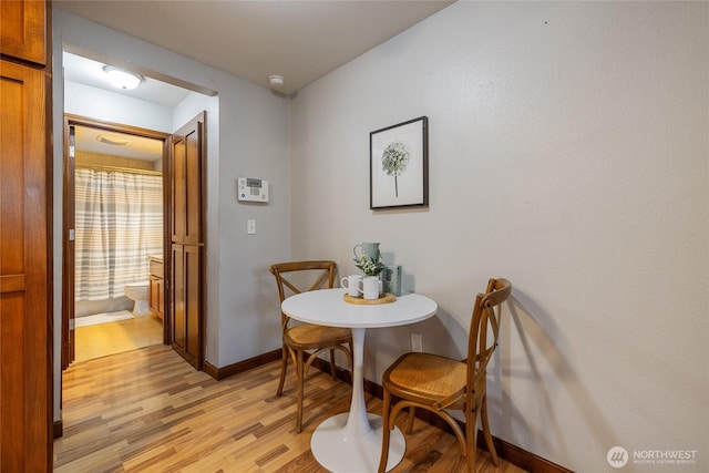 dining area with light hardwood / wood-style flooring