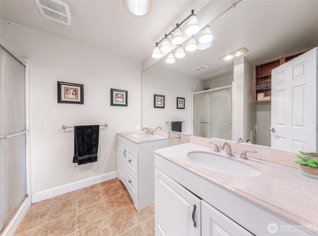 bathroom featuring two vanities, visible vents, a sink, and a shower stall