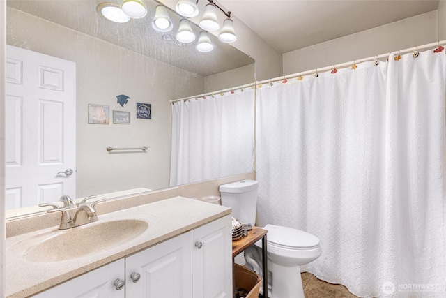 full bath featuring toilet, tile patterned flooring, and vanity