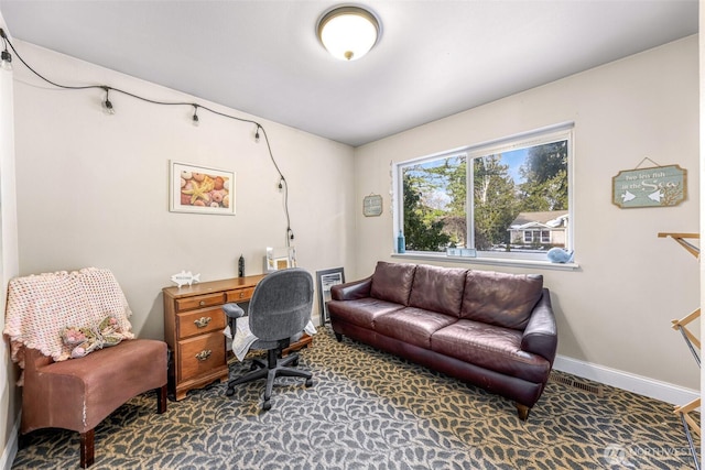 carpeted office with baseboards