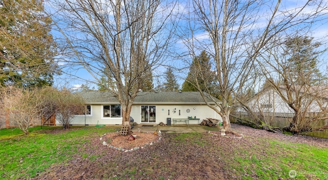 back of house featuring crawl space, a patio area, a fenced backyard, and a yard