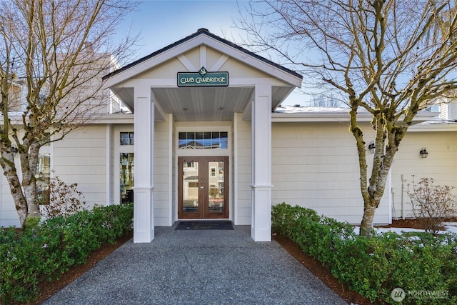 view of exterior entry featuring french doors