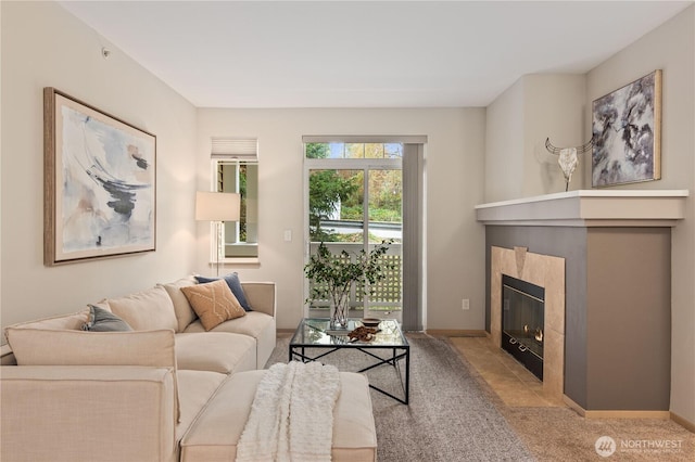 living room with a fireplace and light carpet