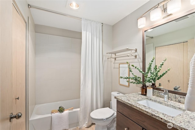 full bathroom with shower / bath combination with curtain, vanity, and toilet