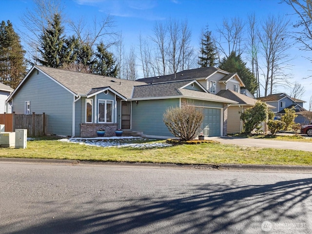 view of front of property featuring a garage and a front yard