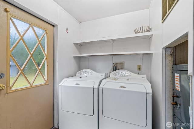 laundry area with laundry area and independent washer and dryer