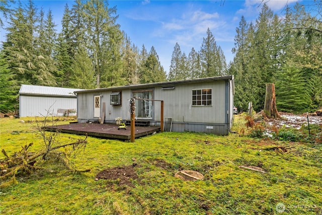 exterior space featuring a deck, a yard, and crawl space