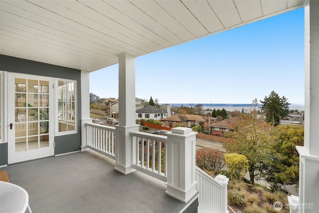 balcony featuring a water view