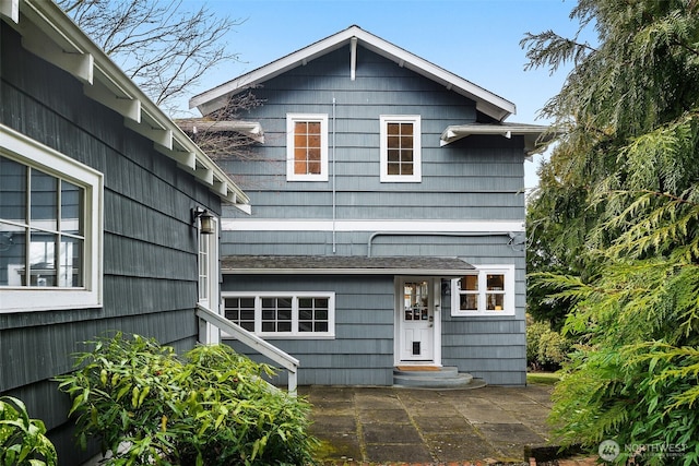 rear view of house featuring a patio