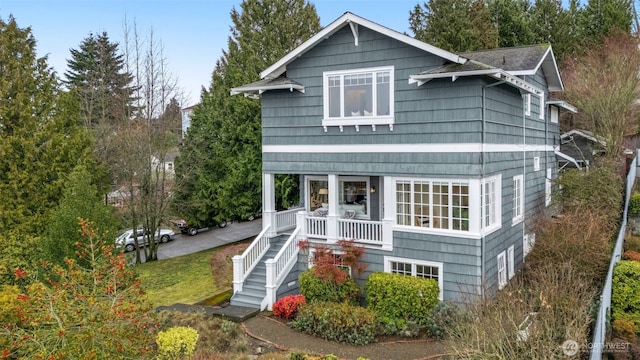 back of house featuring a porch