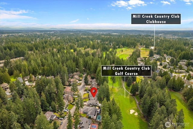 birds eye view of property with a forest view