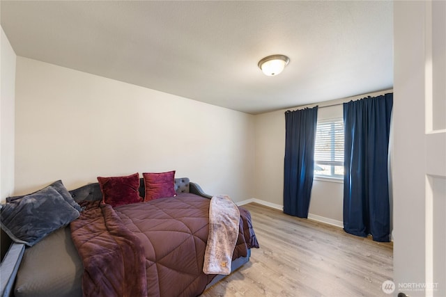 bedroom with light wood-type flooring