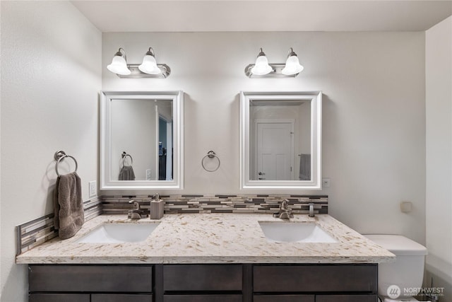 bathroom with vanity and backsplash