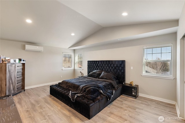 bedroom with lofted ceiling, light wood-type flooring, and an AC wall unit