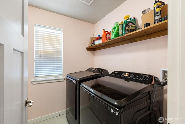 clothes washing area featuring independent washer and dryer