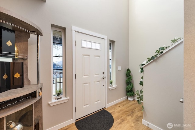 entrance foyer with light hardwood / wood-style floors