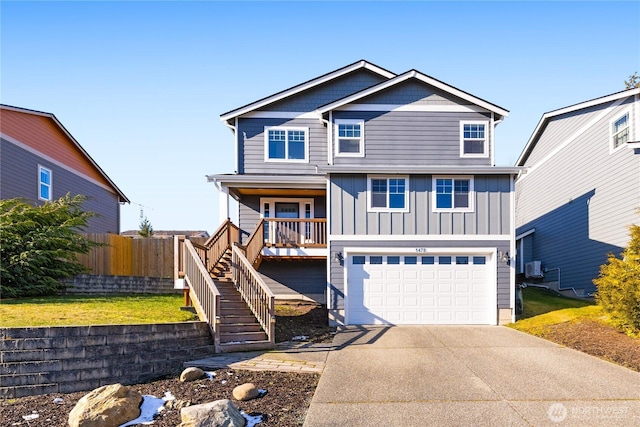 view of front of home featuring a garage and a porch