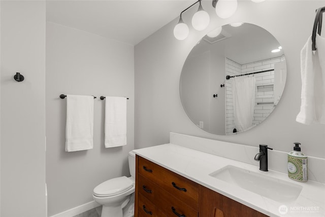 bathroom featuring vanity, toilet, and a shower with shower curtain