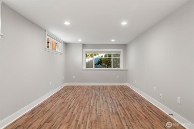 spare room with hardwood / wood-style flooring