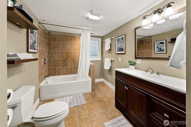 full bath featuring tile patterned flooring, toilet, vanity, baseboards, and shower / bath combination with curtain