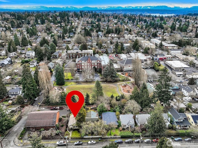 birds eye view of property with a residential view and a mountain view